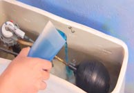 Village Plumbing Tank Dye Ad